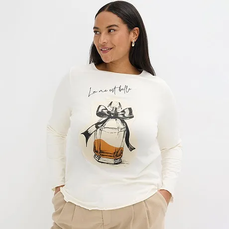 T-shirt couleur crème avec motif flacon de parfum et nœud.