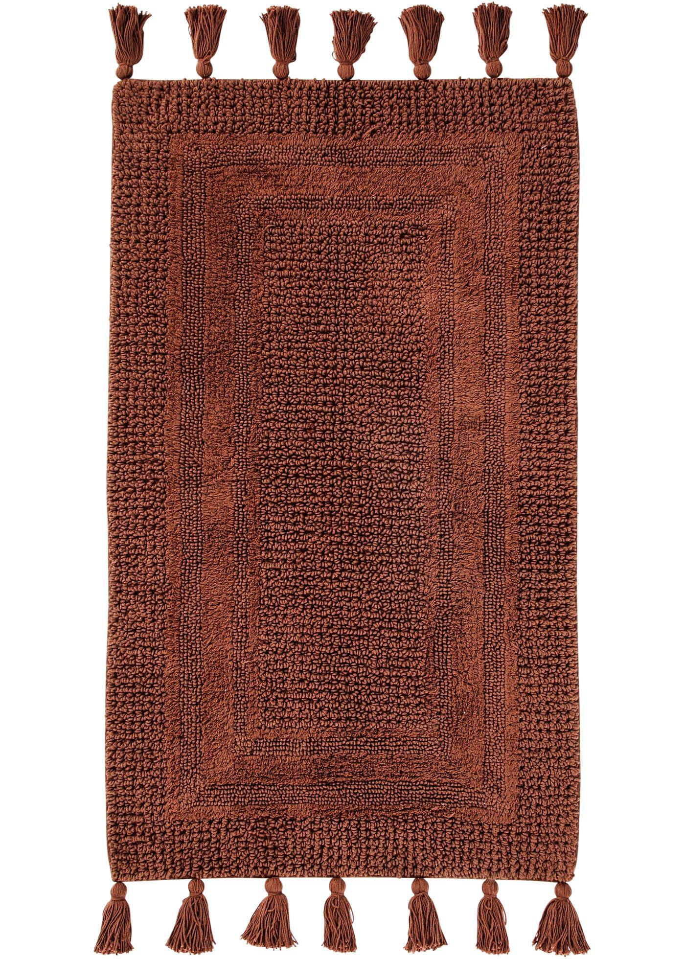 Tapis de salle de bain tufté avec houppes