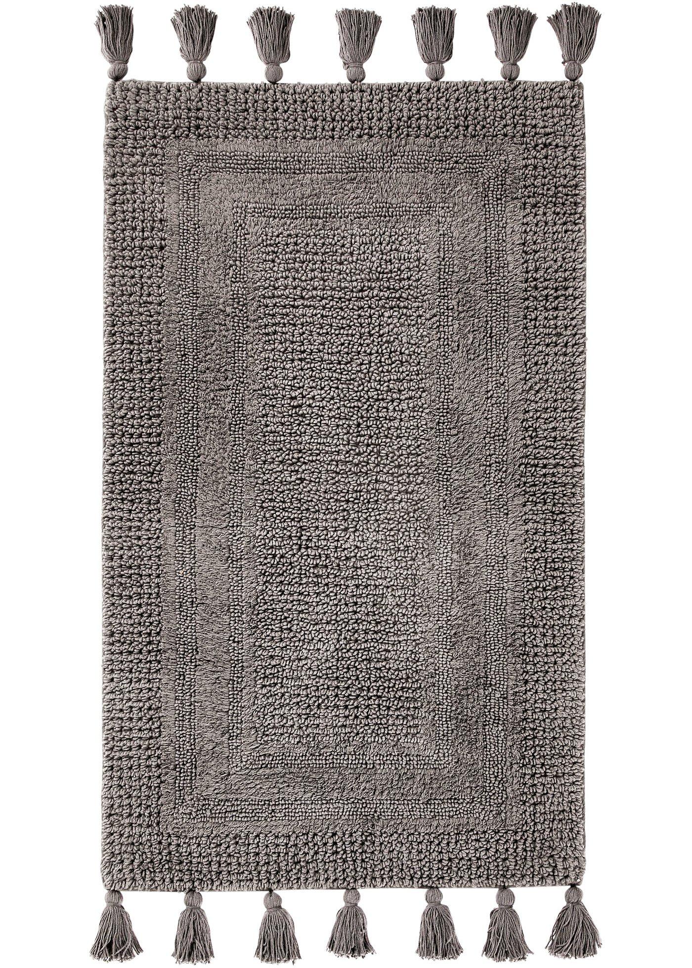 Tapis de salle de bain tufté avec houppes