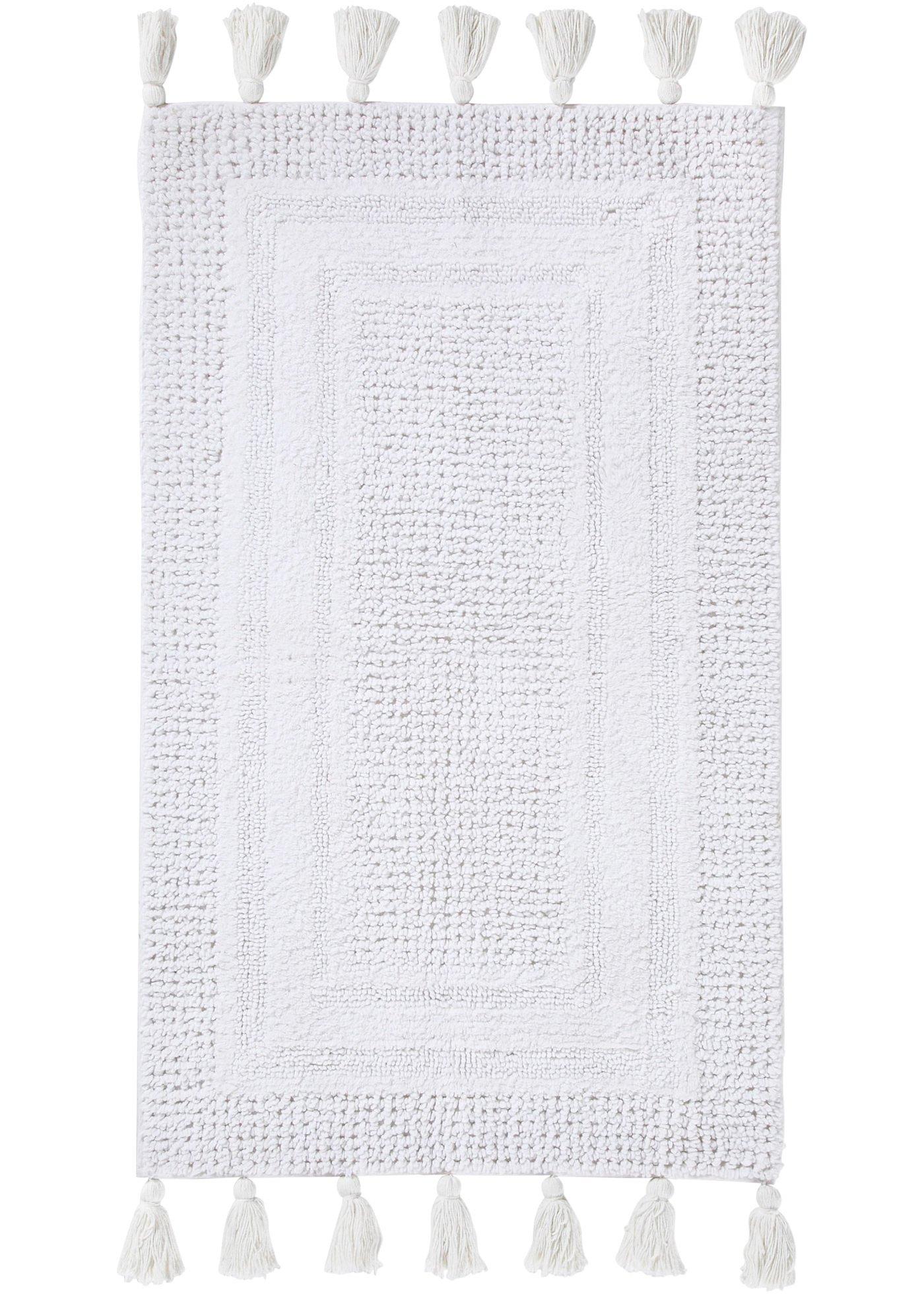 Tapis de salle de bain tufté avec houppes