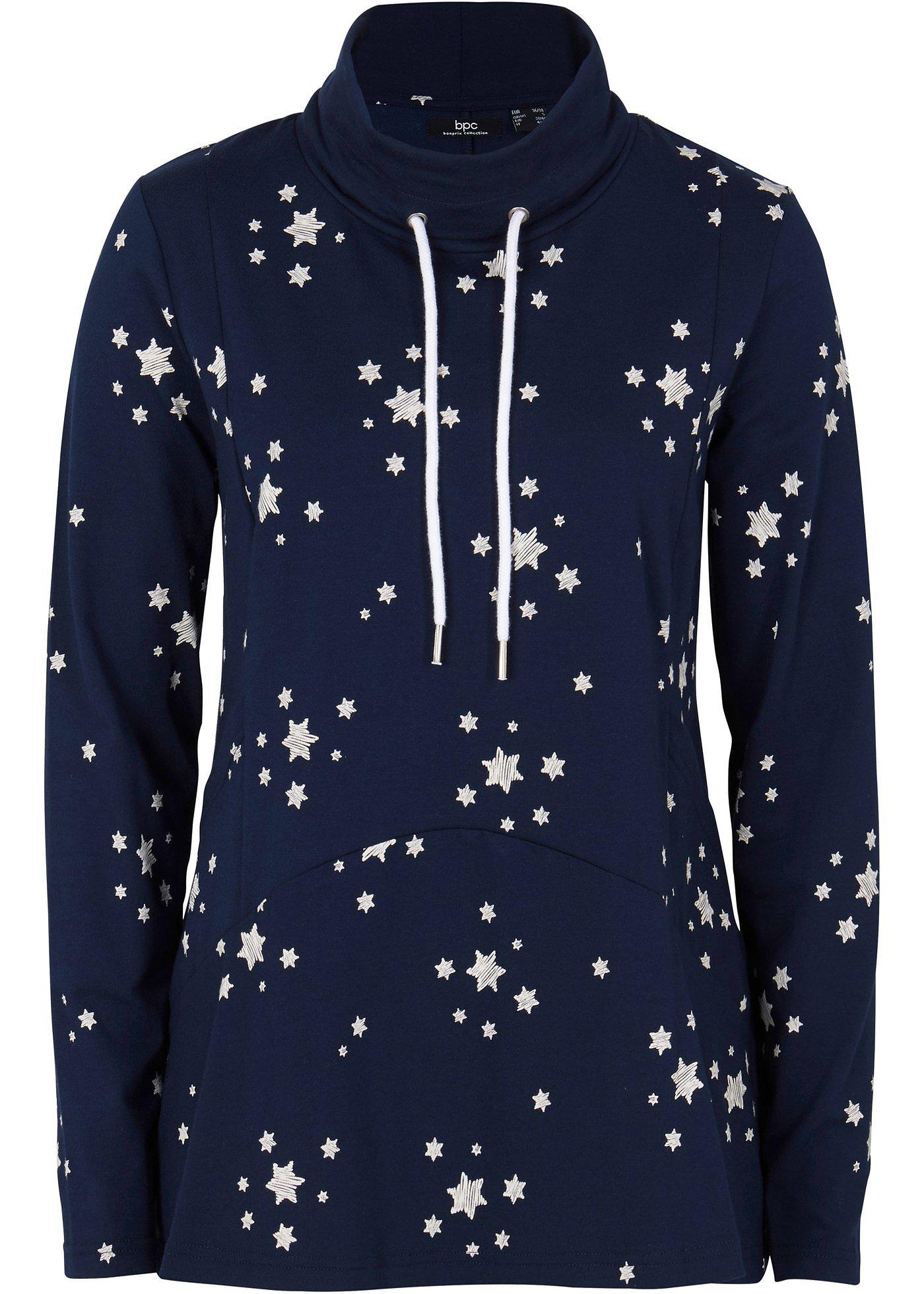 T-shirt style court-long avec col roulé et base volantée