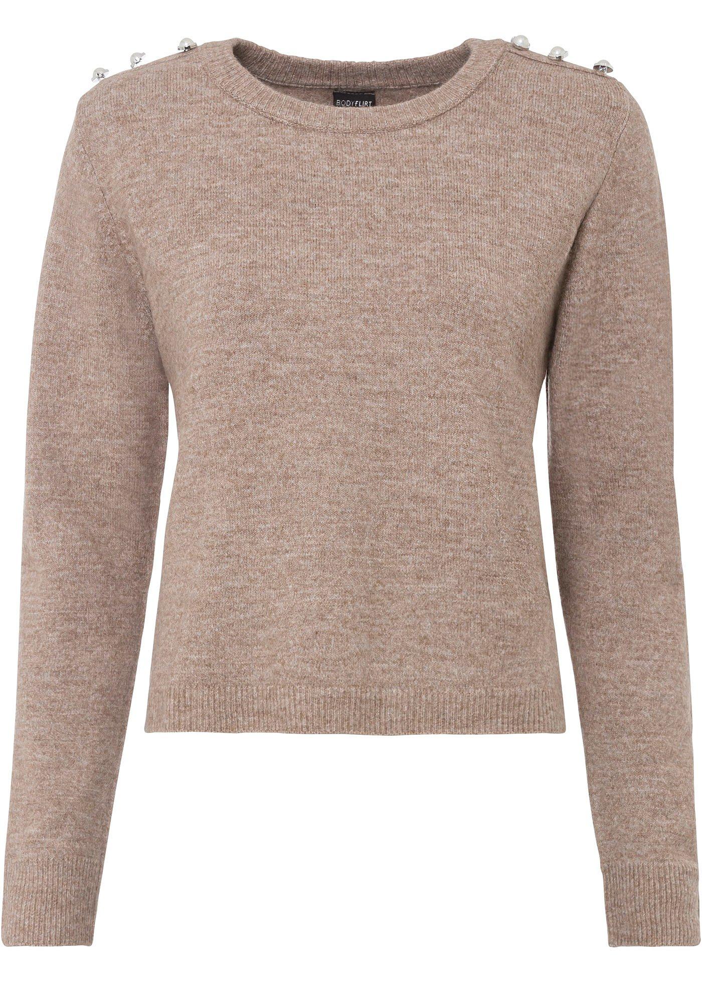 Pull avec boutons bijoux