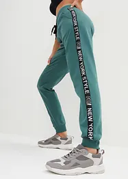 Pantalon en molleton avec lien à nouer et message imprimé, bonprix