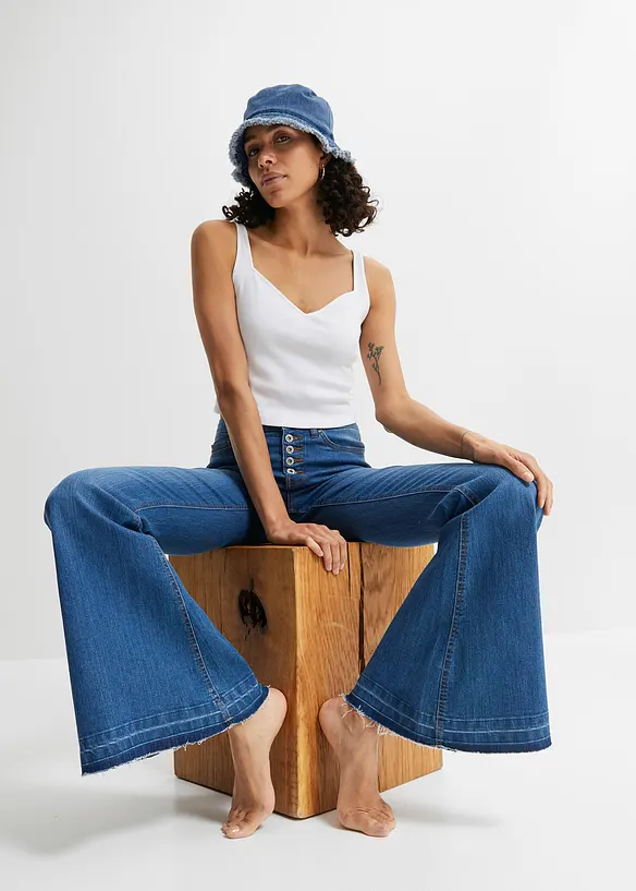 Jean pattes d’éph avec ourlets effilochés, bonprix