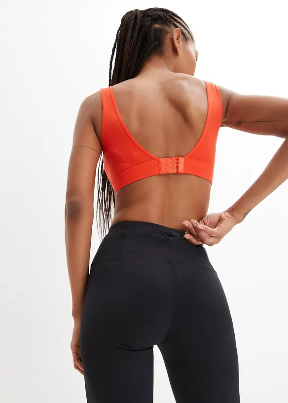 Pantalon de sport sculptant avec poche, jambes évasées, bonprix