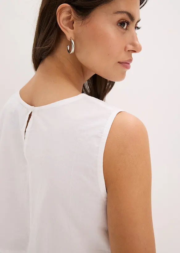 Blouse sans manches avec broderies anglaises, fendue sur les côtés, bonprix