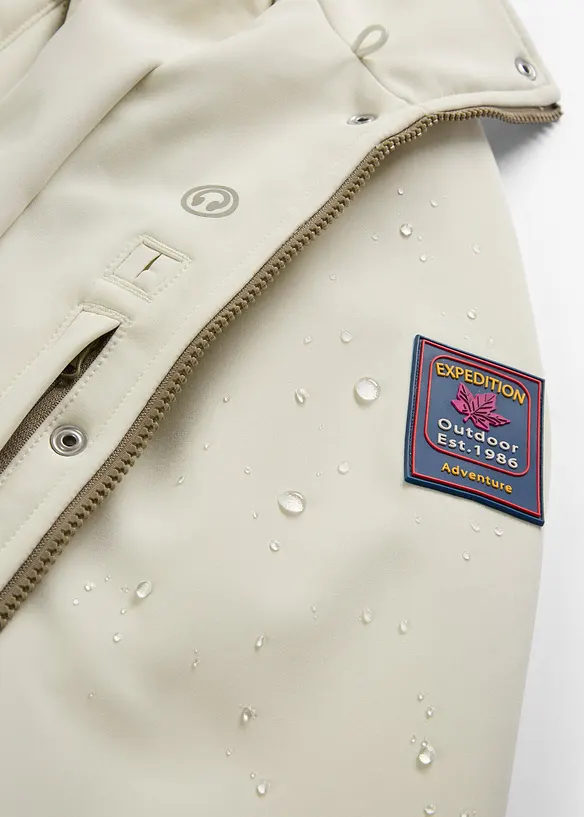 Longue parka en softshell extensible et d&eacute;perlant, bonprix